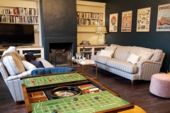 The drawing room with sofas, games table and bar